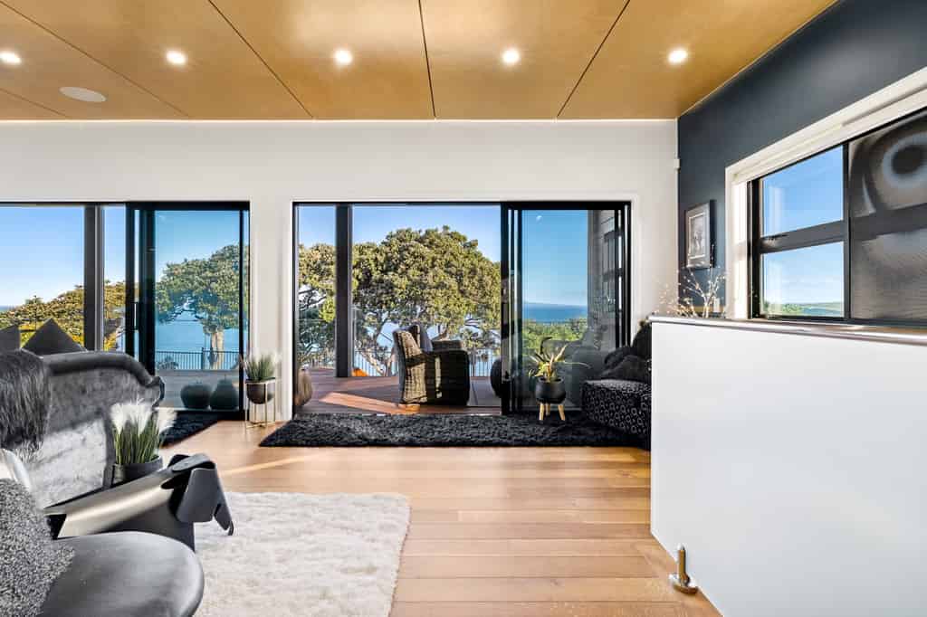 Open-plan living framed by sea views