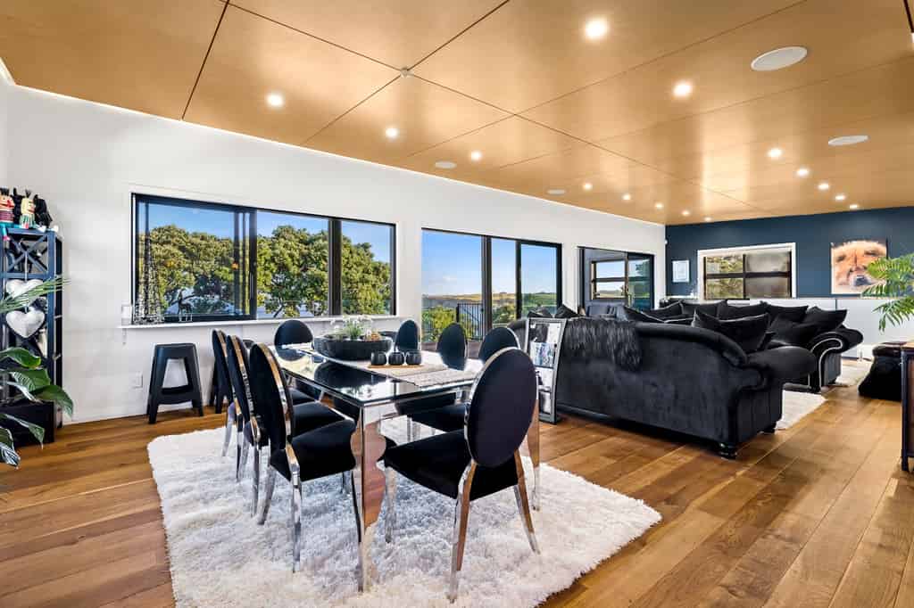 Dining and living spaces with a wide sea outlook
