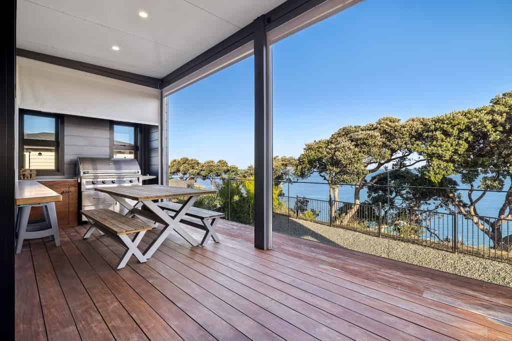 Al fresco dining deck with bay outlook